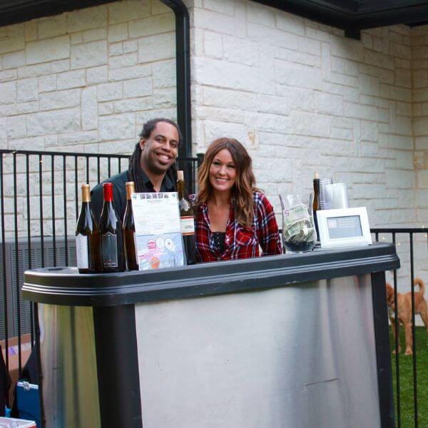 2 Bartenders at a portable bar for a holiday party