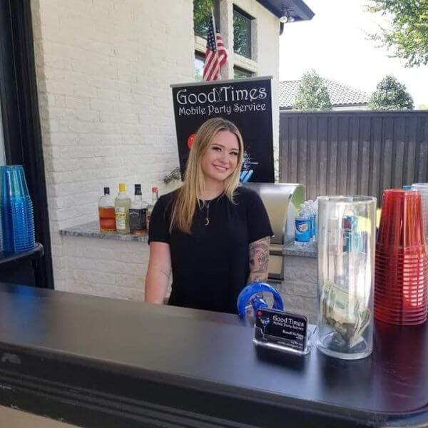 Good Times bartender at a pool party Bartender at a portable bar serving drinks at a pool party.
