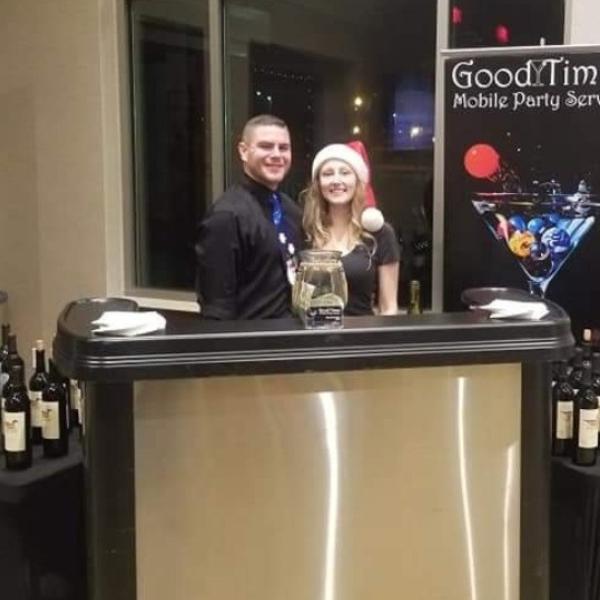 2 bartenders serving at a holiday party